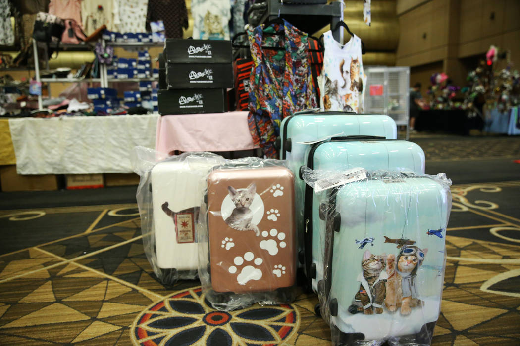 Cat themed merchandise for sale by Paws and Pals during The International Cat Association&#x201 ...
