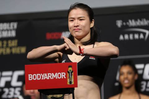 Weili Zhang poses during the ceremonial UFC 235 weigh-in event at T-Mobile Arena in Las Vegas, ...