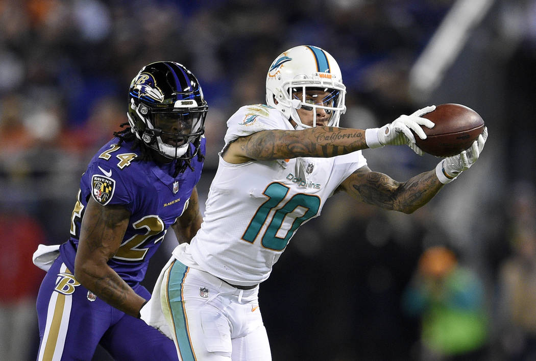 In this Oct. 26, 2017, file photo, Miami Dolphins wide receiver Kenny Stills (10) catches a pas ...