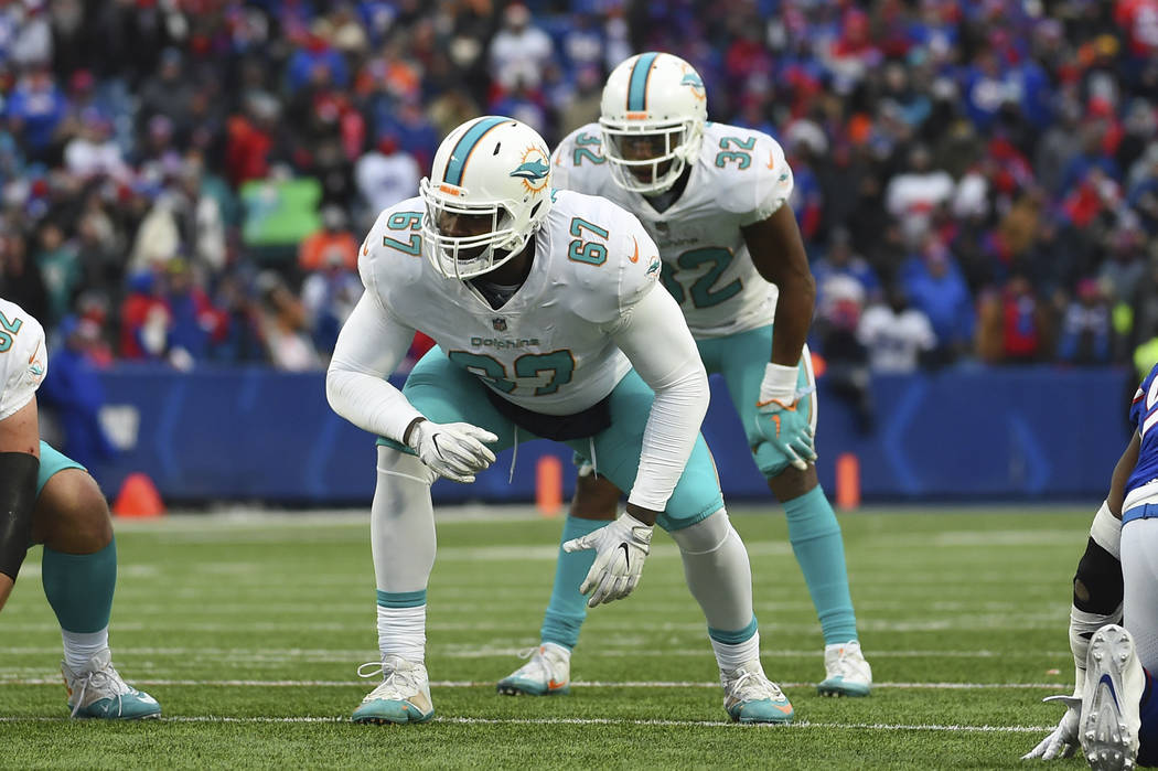 In this Dec. 17, 2017, file photo, Miami Dolphins offensive tackle Laremy Tunsil (67) lines up ...