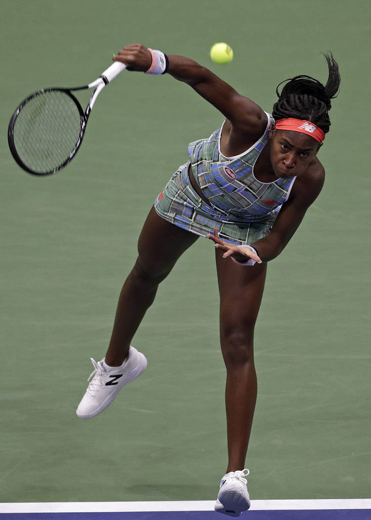 Coco Gauff serves to Naomi Osaka, of Japan, during the third round of the U.S. Open tennis tour ...