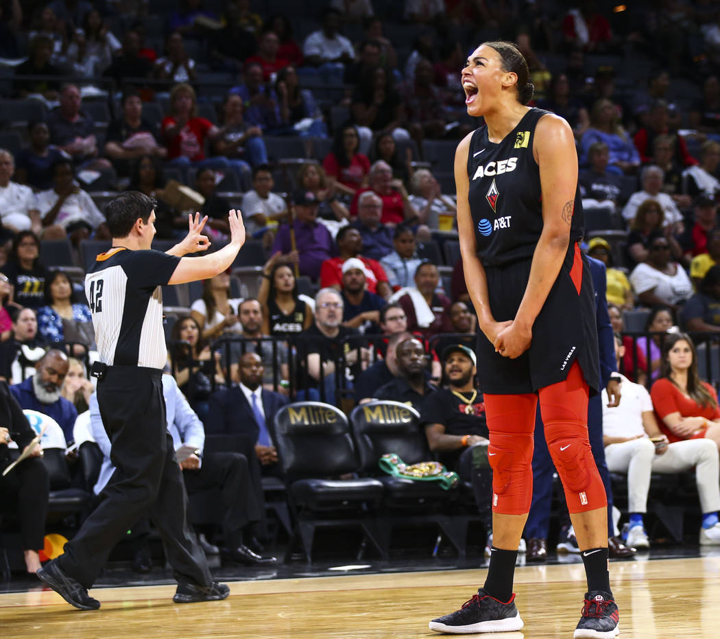Las Vegas Aces' center Liz Cambage (8) reacts after a foul was called on her during the first h ...