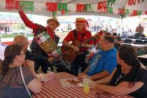 Emilio Baglioni, left, and Aldo Vallera serenade a group of people during the San Gennaro Feast ...