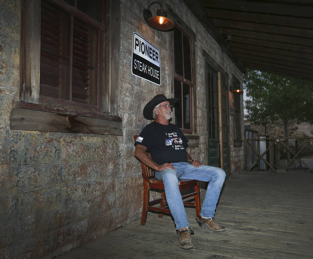 Jeff Humpres, 64, from Sandy Valley, relaxes on the front of the Pioneer Saloon in Goodsprings, ...