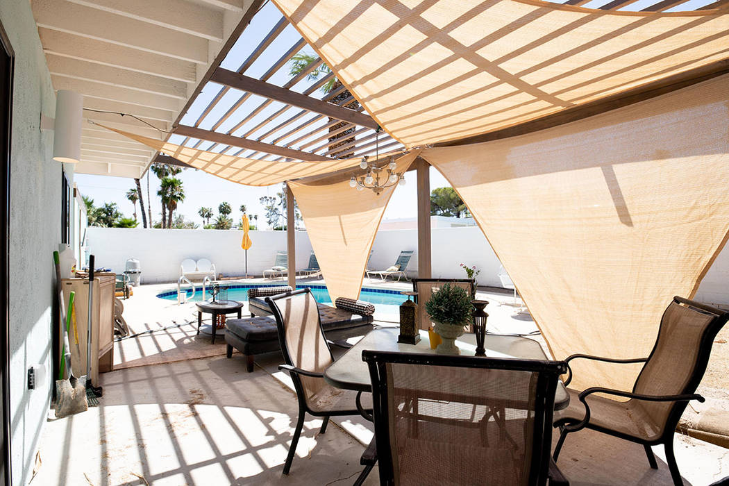The midcentury home has a backyard patio and pool. (Tonya Harvey/Real Estate Millions)