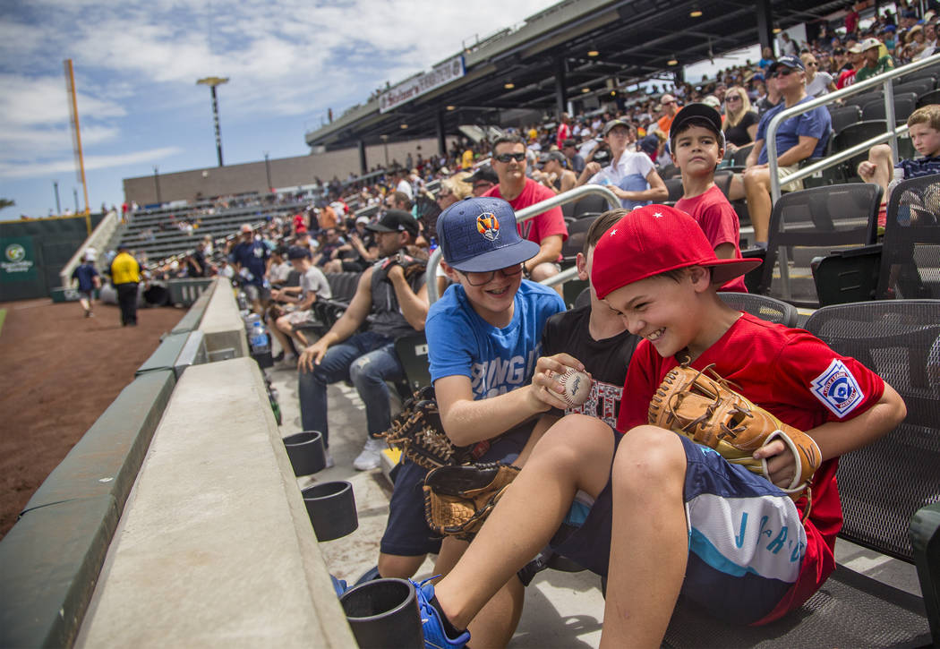Robby Parker, 11, tries to steal the ball from his friend Jacob Freeman, 10, at the Las Vegas B ...