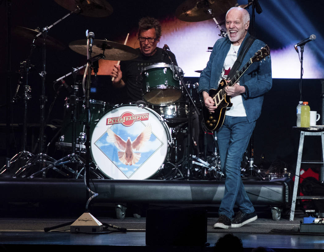 Peter Frampton performs on stage at Ameris Bank Amphitheatre, Sunday, Aug. 11, 2019, in Alphare ...