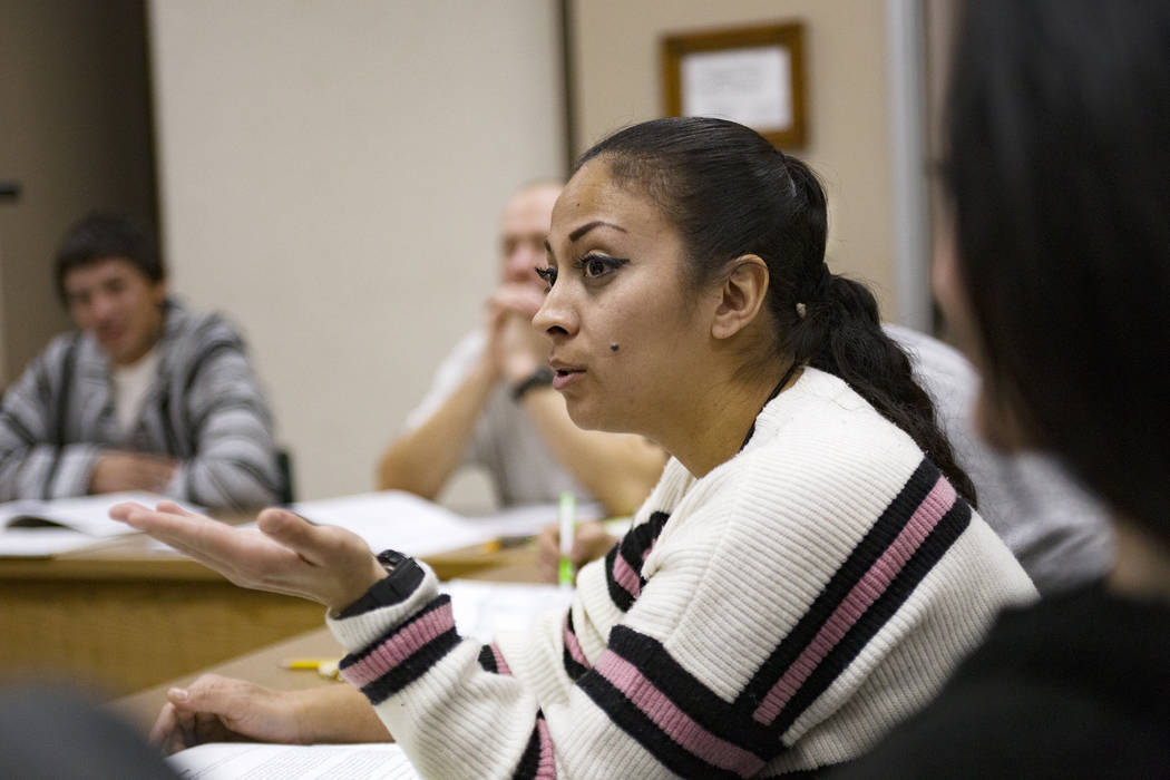 Inmate Yesenia La Rue asks a question during Moral Recognition Therapy class at Casa Grande, a ...