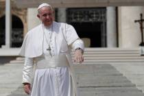 Pope Francis salutes pilgrims and faithful as he leaves St. Peter's Square at the Vatican after ...