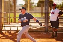 George Kuehnel, 74, prepares to go to first base, as Tony Videl, 68, background, looks on at Lo ...