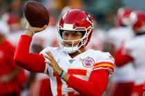 Kansas City Chiefs' Patrick Mahomes warms up before a preseason NFL football game against the G ...