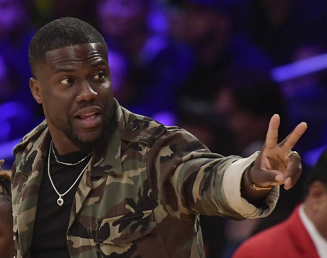 In this Jan. 29, 2019, file photo, actor Kevin Hart gestures during the second half of an NBA b ...