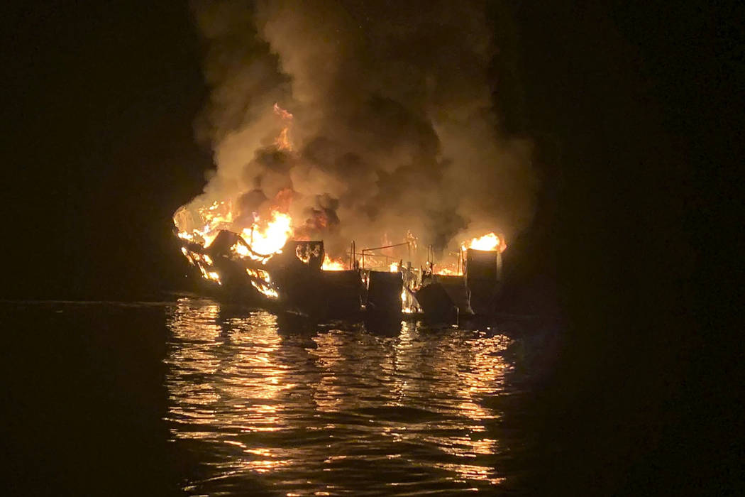 In this photo provided by the Santa Barbara County Fire Department a dive boat is engulfed in f ...