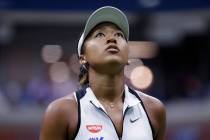 Naomi Osaka, of Japan, looks up at the score board during her match against Belinda Bencic, of ...