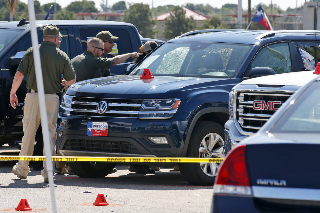 Officials continue to work the scene, Monday, Sept. 2, 2019, in Odessa, Texas, where teenager L ...