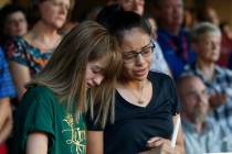 High School students Celeste Lujan, left, and Yasmin Natera mourn their friend Leila Hernandez, ...