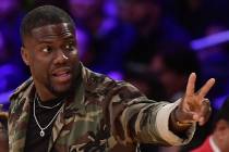 In this Jan. 29, 2019, file photo, actor Kevin Hart gestures during the second half of an NBA b ...