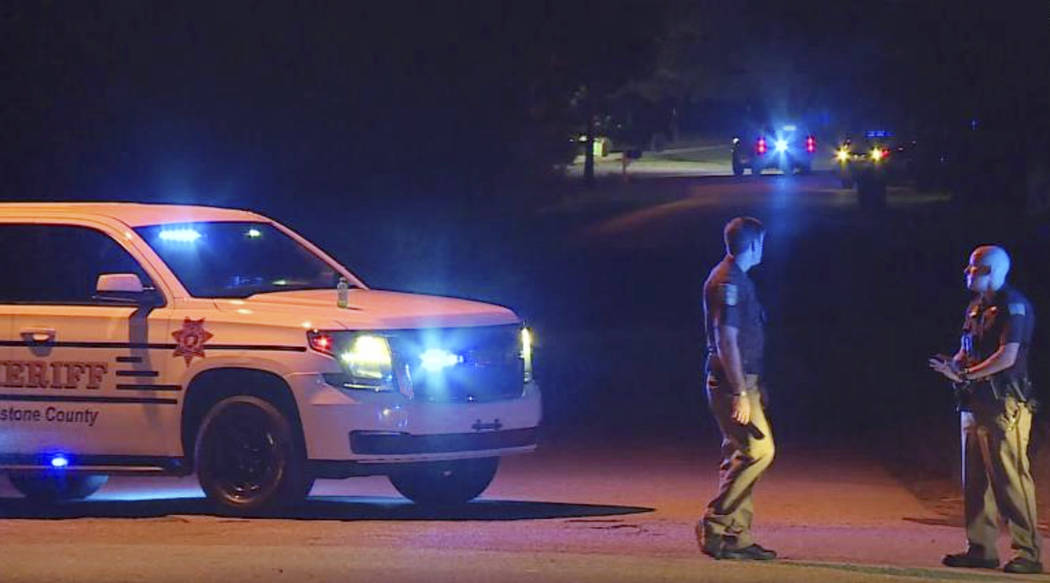 In this photo provided by WHNT-TV News, authorities block access to a street, in Elkmont, Ala., ...