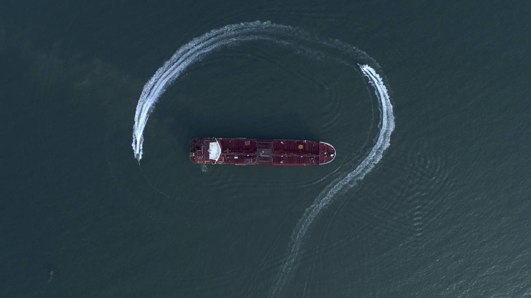 A July 21, 2019, file photo, an aerial view shows a speedboat of Iran's Revolutionary Guard mov ...