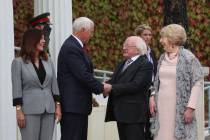 US Vice President Mike Pence, center left, with his wife Karen shakes hands with Irish Presiden ...