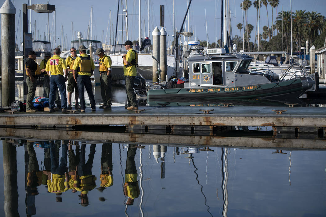 Divers with the San Luis Obispo County Sheriff's Dive Team prepare to search for a second day f ...