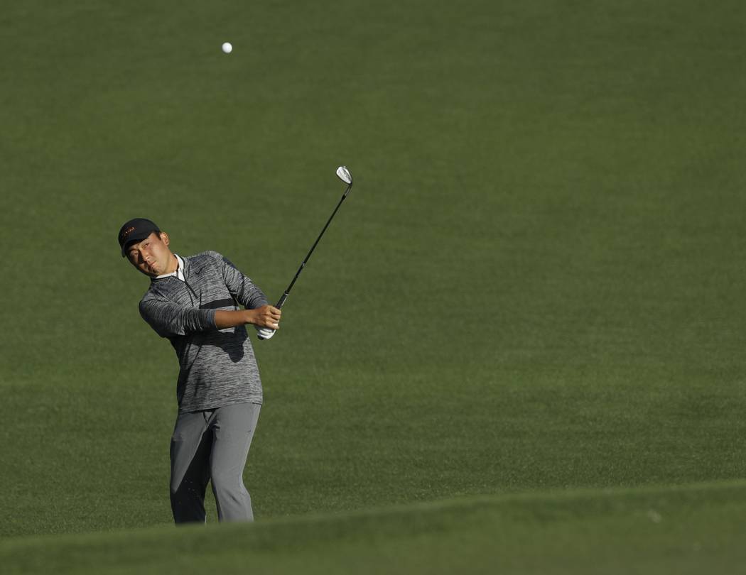 Doug Ghim hits a shot on the second hole during the second round at the Masters golf tournament ...