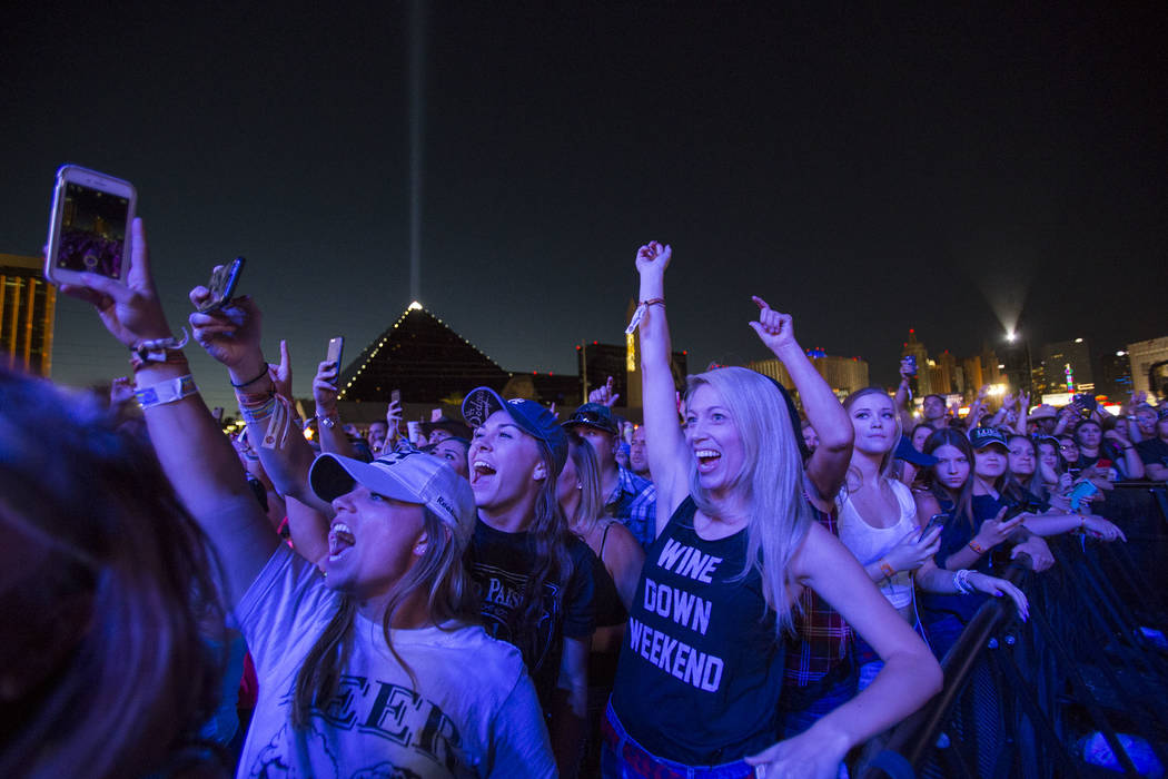 Festival-goers enjoy the sounds of country music artist Dustin Lynch on day 3 of the Route 91 H ...
