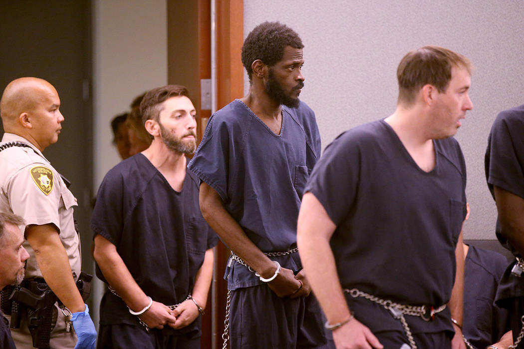 Clinton Taylor, center, appears in court at the Regional Justice Center in Las Vegas Wednesday, ...