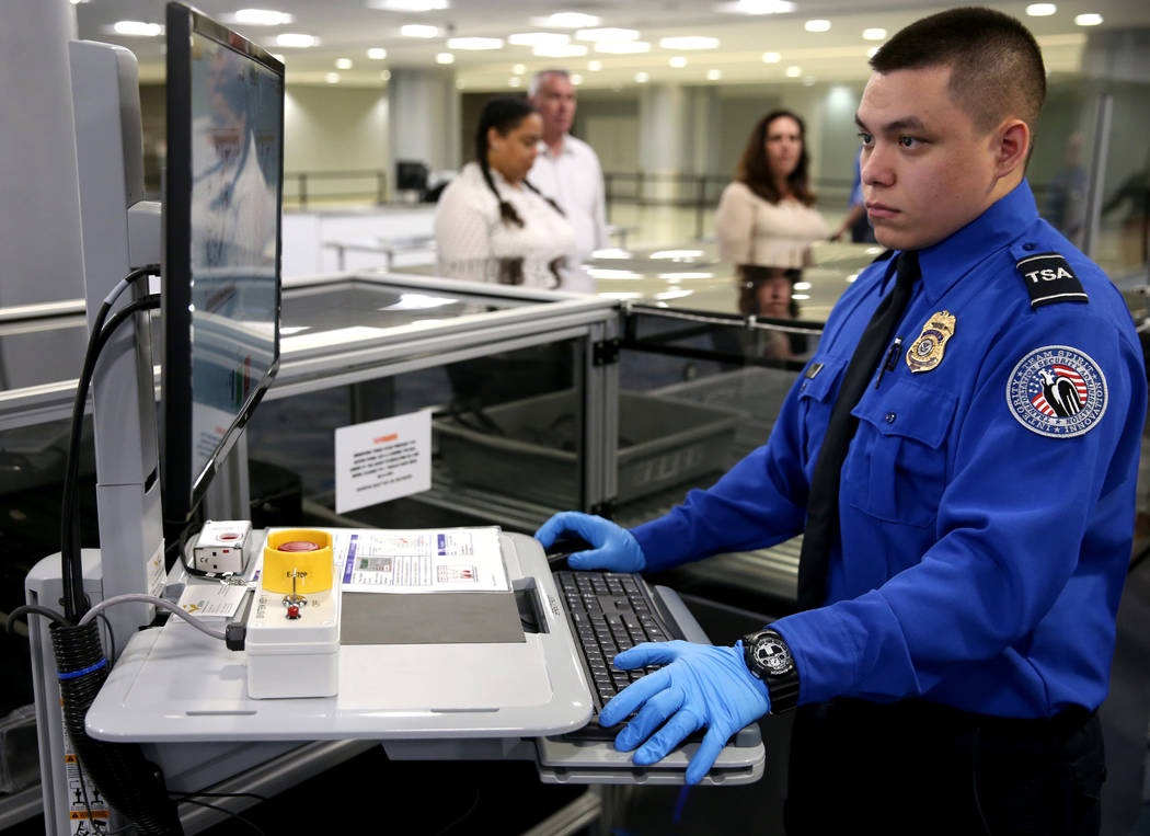 Transportation Security Officer Duenas demonstrates a 3D scanner during an announcement for the ...