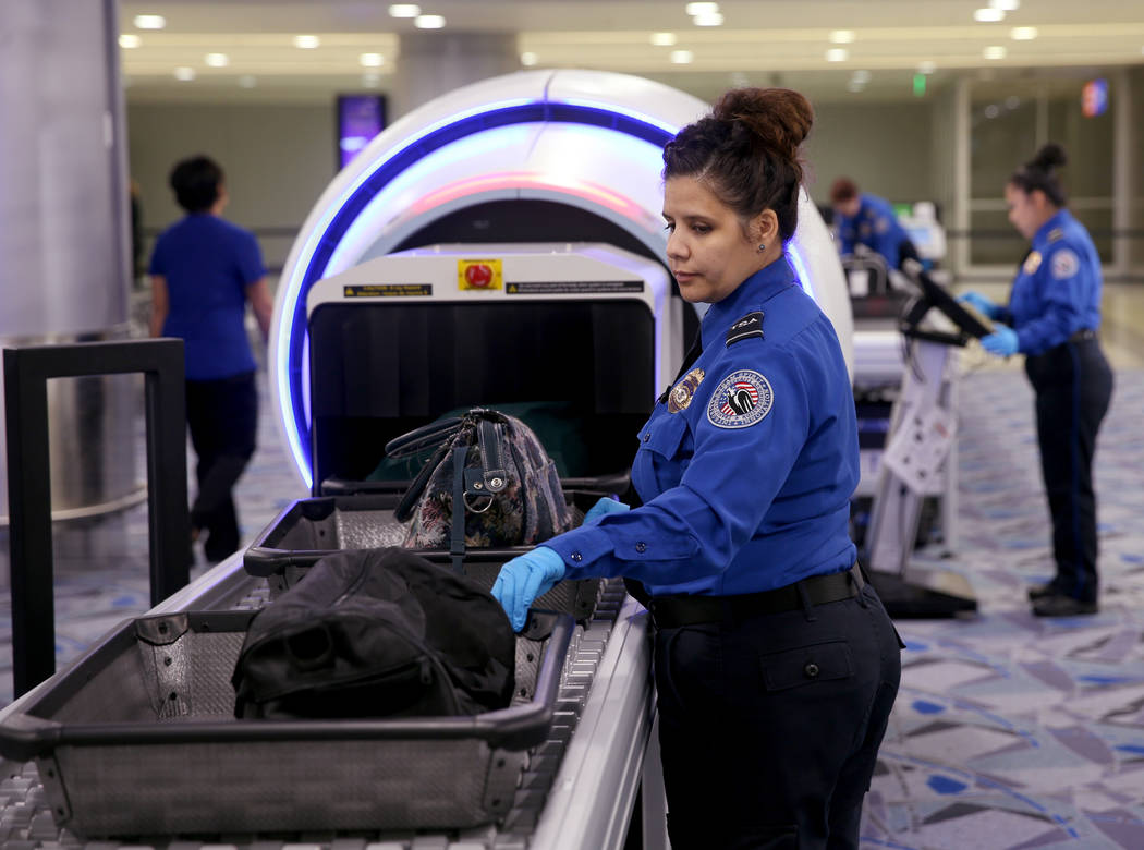 Transportation Security Officer Aguayo demonstrates a 3D scanner during an announcement for the ...