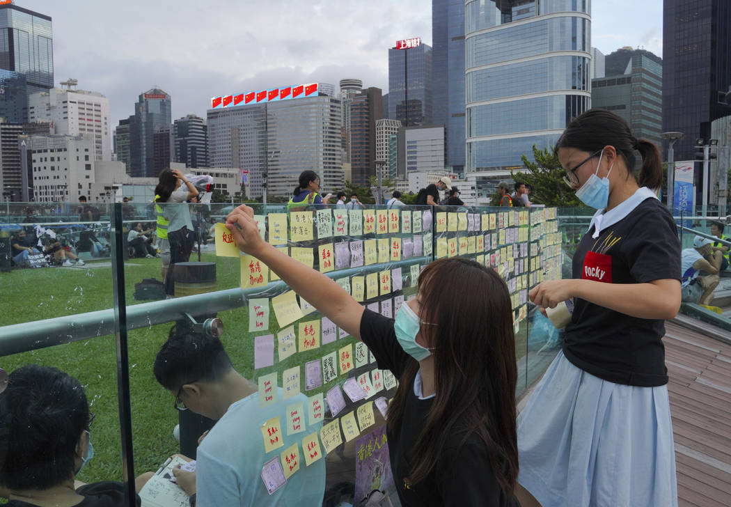 Protesters put their massage on Sticky Note Lennon Walls during continuing pro-democracy rallie ...
