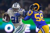 In a Jan. 12, 2019, file photo, Dallas Cowboys running back Ezekiel Elliott pushes off Los Ange ...