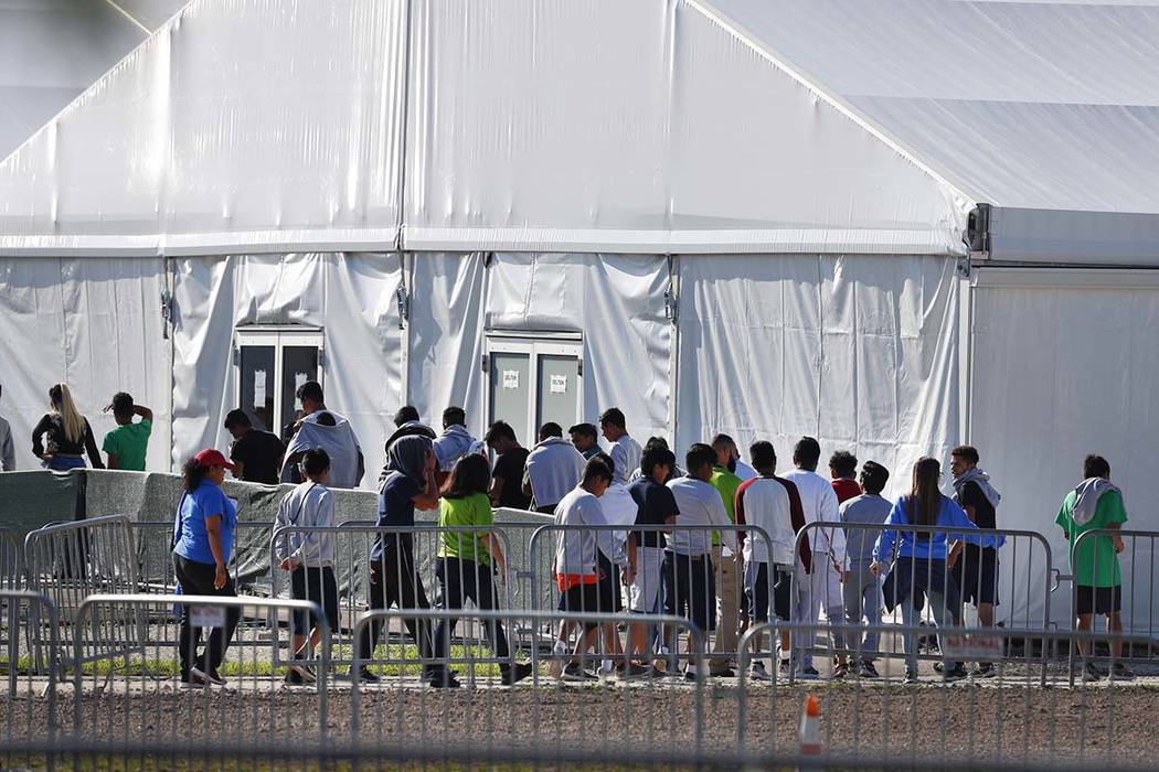 In a Feb. 19, 2019, file photo, children line up to enter a tent at the Homestead Temporary She ...