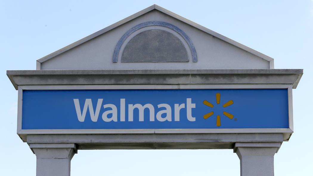 A Walmart logo forms part of a sign outside a Walmart store, Tuesday, Sept. 3, 2019, in Walpole ...