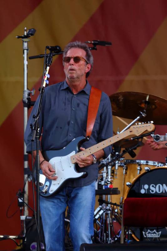Eric Clapton performs at the 2014 New Orleans Jazz & Heritage Festival at Fair Grounds Race ...