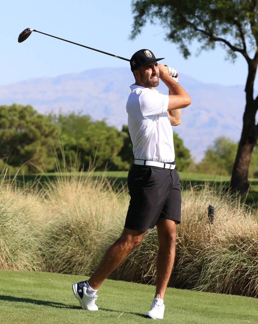 Golden Knights right wing Alex Tuch watches his drive during the Golden Knights charity golf to ...