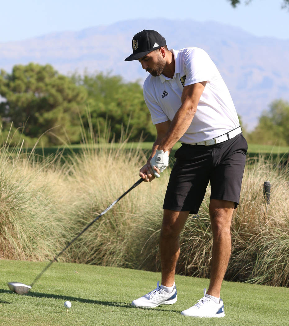 Golden Knights right wing Alex Tuch hits his drive during the Golden Knights charity golf tourn ...