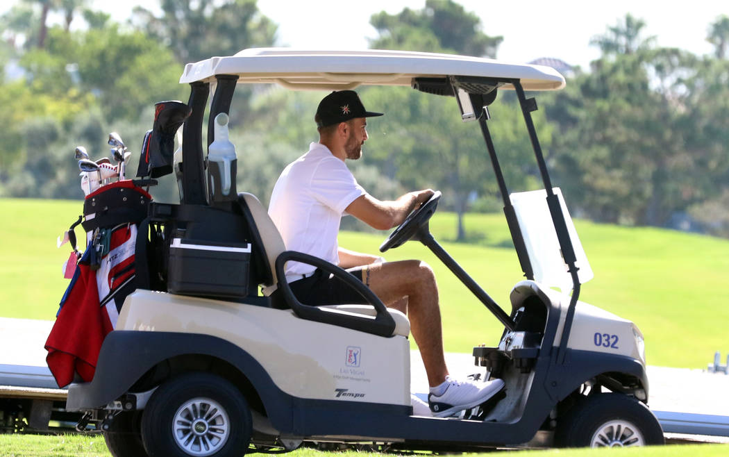 The Vegas Golden Knights right wing Alex Tuch drives his golf cart during the Golden Knights ch ...