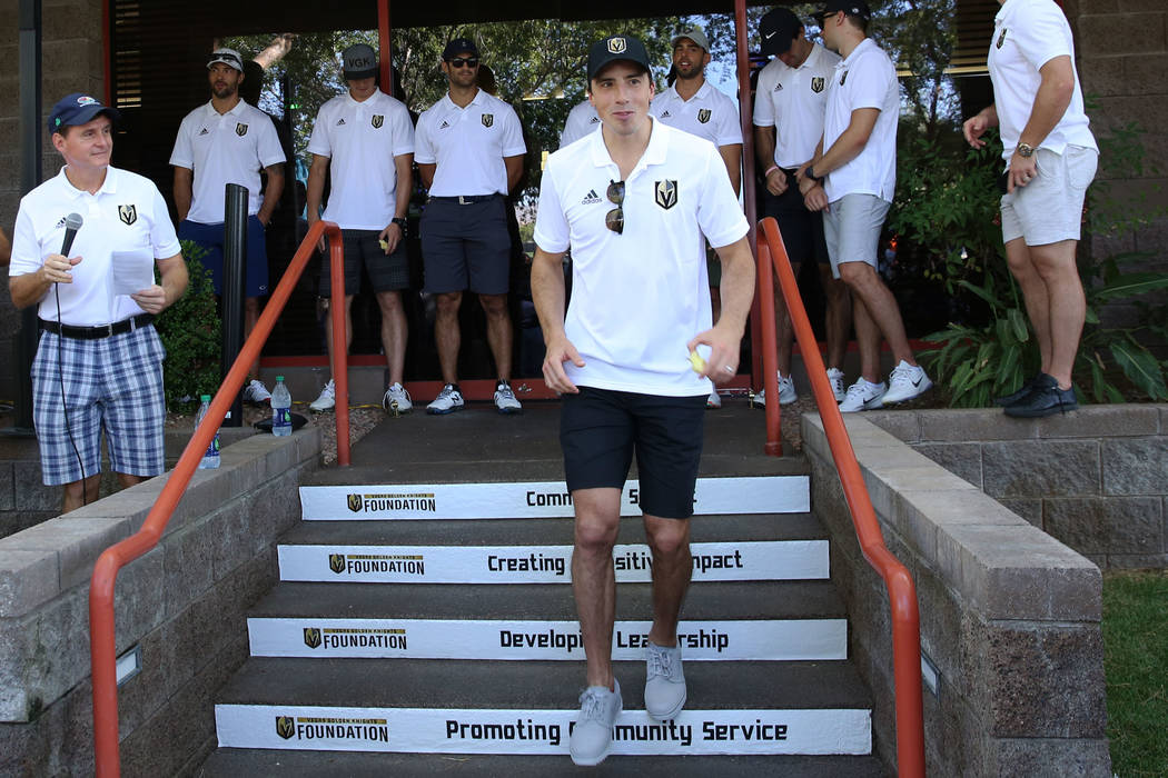 Golden Knights goalie Marc-Andre Fleury walks to his golf cart at TPC Summerlin to participate ...