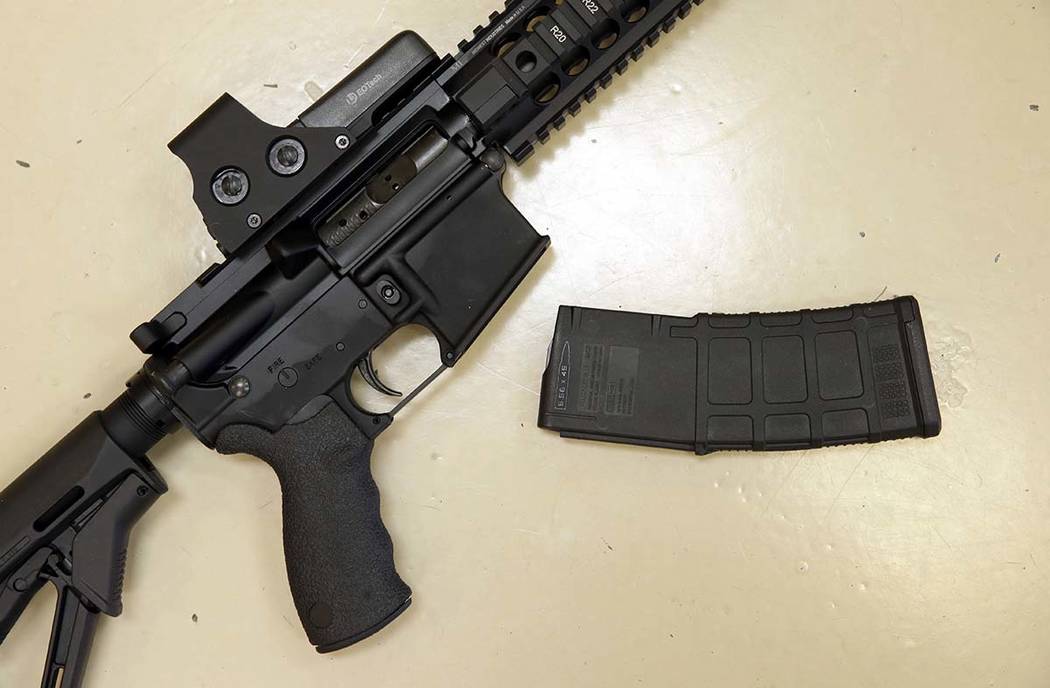 In this Oct. 3, 2013, file photo, a custom-made semi-automatic hunting rifle with a high-capaci ...