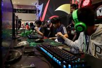 In this Thursday, Aug. 29, 2019, photo, esport (electronic sport) players react after winning t ...