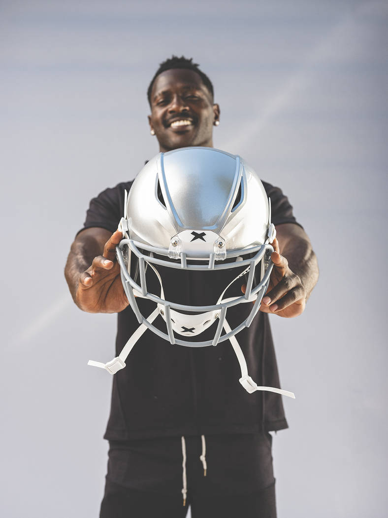 Raiders wide receiver Antonio Brown displays his new helmet, the Shadow by helmet-maker Xenith. ...