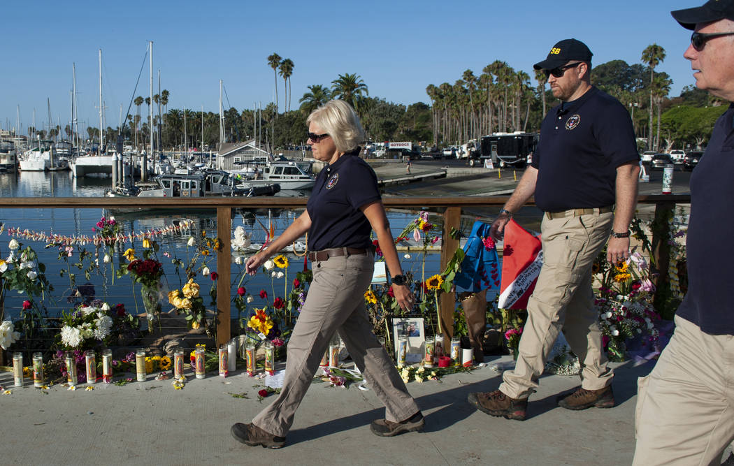 National Transportation Safety Board member Jennifer Homendy and her team walk past a memorial ...