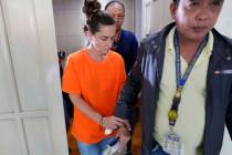 American Jennifer Erin Talbot from Ohio is escorted after a press conference by the National Bu ...