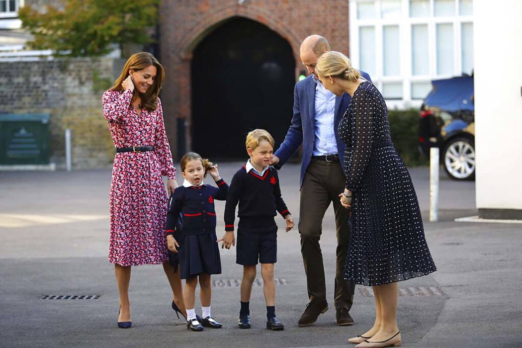 Helen Haslem, right, head of the lower school greets Britain's Princess Charlotte, second left, ...
