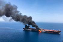A June 13, 2019, file photo, an oil tanker is on fire in the Gulf of Oman. The U.S. Navy is try ...