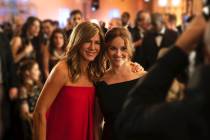 This image released by Apple TV Plus, Jennifer Aniston, left, and Reese Witherspoon appear in a ...