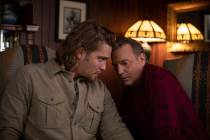 Kayce (L-Luke Grimes) talks with his father (R-Kevin Costner) and decides to track down evidenc ...