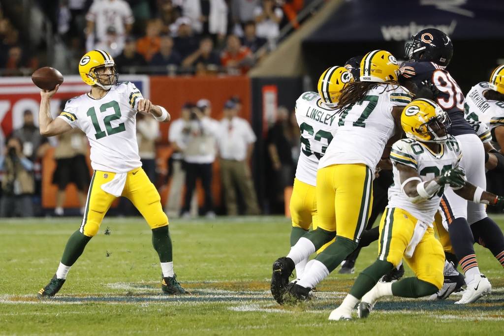 Green Bay Packers' Aaron Rodgers throws during the first half of an NFL football game against t ...