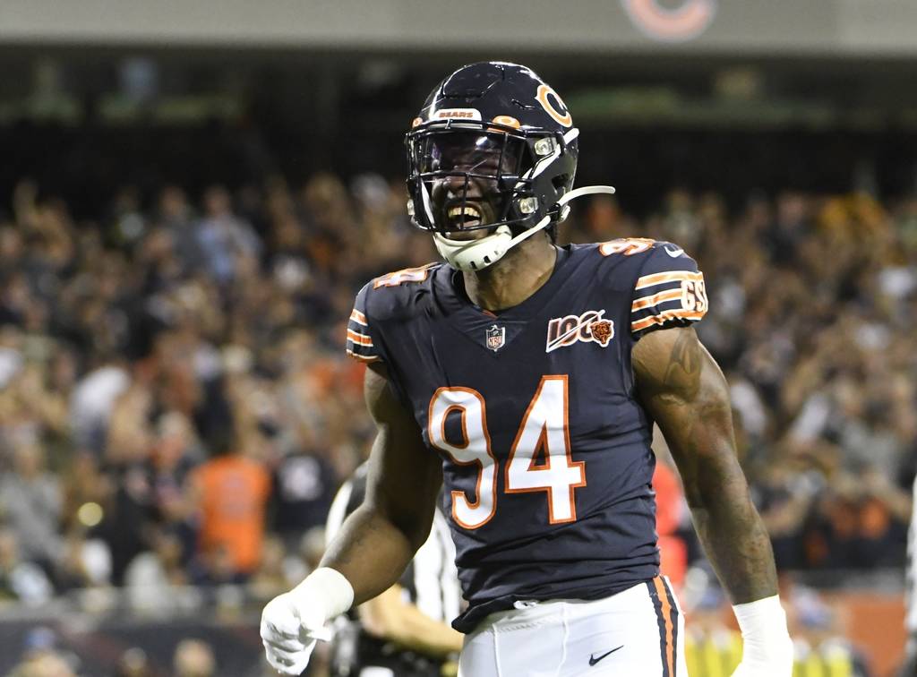Chicago Bears' Leonard Floyd reacts after sacking Green Bay Packers' Aaron Rodgers during the f ...